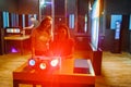 Female students making optical experiments confirming the physical law of wave