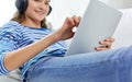 Teenage girl listening to music on tablet computer Royalty Free Stock Photo