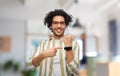 happy man in glasses showing smart watch at office Royalty Free Stock Photo