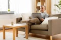 Man with laptop computer sitting on sofa at home Royalty Free Stock Photo
