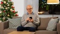 happy senior man with smartphone on christmas Royalty Free Stock Photo