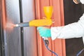 Polymer coating of metal detail with powder spraying gun Royalty Free Stock Photo