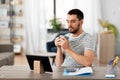 Man with tablet pc drinking coffee at home office Royalty Free Stock Photo