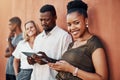 Technology runs this generation. Cropped portrait of an attractive young businesswoman standing with her colleagues Royalty Free Stock Photo