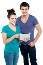 Technology savvy couple browsing Royalty Free Stock Photo