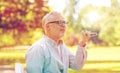 Old man using voice command recorder on smartphone Royalty Free Stock Photo