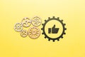 Technology for a set of likes and approvals in social networks. Icon thumbs up with gears.