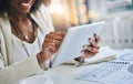 Technology that simplifies your day to day tasks. an unrecognizable businesswoman using her digital tablet at her office Royalty Free Stock Photo