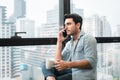 Technology Smartphone and Communication Concept, Portrait of Business Handsome Man is Calling on Cellphone at Office Workplace. Royalty Free Stock Photo