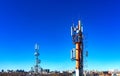 Technology on top of the telecommunication GSM 4G tower antenna, transmitter , blue sky, white clouds.