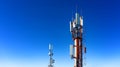 Technology on top of the telecommunication GSM 4G tower antenna, transmitter , blue sky, white clouds.