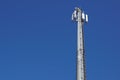 Technology on the top of the telecommunication GSM 4G tower antenna, transmitter , blue sky, white clouds.