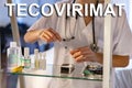 Tecovirimat. Nurse. Medical. Text written on an unfocused background and virus design of a nurse with an injection Royalty Free Stock Photo