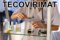 Tecovirimat. Nurse. Medical. Text written on an unfocused background and virus design of a nurse with an injection Royalty Free Stock Photo