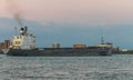 The TECUMSEH Bulk Carrier ship on the Detroit River at dusk Royalty Free Stock Photo