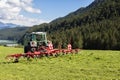 Tedding hay with tractor Royalty Free Stock Photo