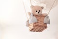 Teddy bear in a aerostatic balloon toy hanging from the ceiling. Royalty Free Stock Photo