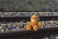 Teddy bear alone on railway