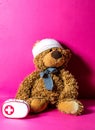 Teddy bear with bandage and first aid for mishap concept Royalty Free Stock Photo