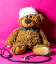 Teddy bear with bandage and stethoscope for child medical education Royalty Free Stock Photo