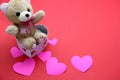 teddy bear, box of chocolates and pink hearts with ribbon on red background, Valentine`s Day gifts, advertising banner Royalty Free Stock Photo