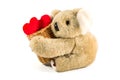 Teddy bear carrying bamboo basket full of heart Royalty Free Stock Photo