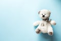 Teddy bear child toy on pastel baby blue background with copy space Royalty Free Stock Photo