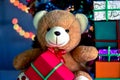 Teddy Bear in Christmas and Multi colored balls on christmas tree Royalty Free Stock Photo