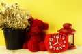 Teddy bear and clock with space on yellow background Royalty Free Stock Photo