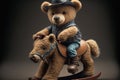 Teddy bear in cowboy outfit riding a rocking horse Royalty Free Stock Photo