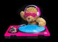 Teddy bear djing on turntables with headphones