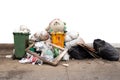 Teddy bear on the garbage pile isolated in white background. Royalty Free Stock Photo