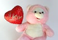 Teddy bear with heart balloon