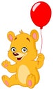 Teddy bear holding balloon