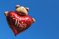 Teddy bear holding a heart Royalty Free Stock Photo
