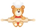 Teddy bear holding rolling pin