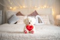 Teddy bear hug heart pillow on bed, Valentine& x27;s concept Royalty Free Stock Photo