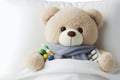 Teddy bear laying in bed and feeling sick isolated on solid white background. ai generative Royalty Free Stock Photo