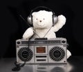 Teddy bear listening to music on a ghettoblaster Royalty Free Stock Photo