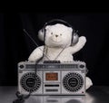 Teddy bear listening to music on a ghettoblaster Royalty Free Stock Photo