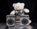 Teddy bear listening to music on a ghettoblaster Royalty Free Stock Photo