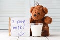 Teddy bear love milk, kid breakfast concept Royalty Free Stock Photo