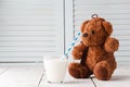 Teddy bear love milk, kid breakfast concept Royalty Free Stock Photo