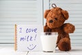 Teddy bear love milk, kid breakfast concept Royalty Free Stock Photo