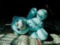 A Teddy Bear lying on bed and busk in the sun Royalty Free Stock Photo