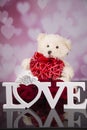 Teddy bear mascot, red roses and hearts for valentine`s day Royalty Free Stock Photo