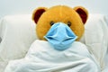 Teddy bear with mask, sick of coronavirus in a hospital Royalty Free Stock Photo