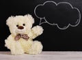 Teddy bear near blackboard. Valentines Day background. drawing with chalk on blackboard