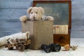 Teddy bear with old book, post box with antique letters and old map with binoculars Royalty Free Stock Photo