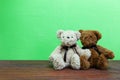 Teddy bear on old wood in front green background. Royalty Free Stock Photo